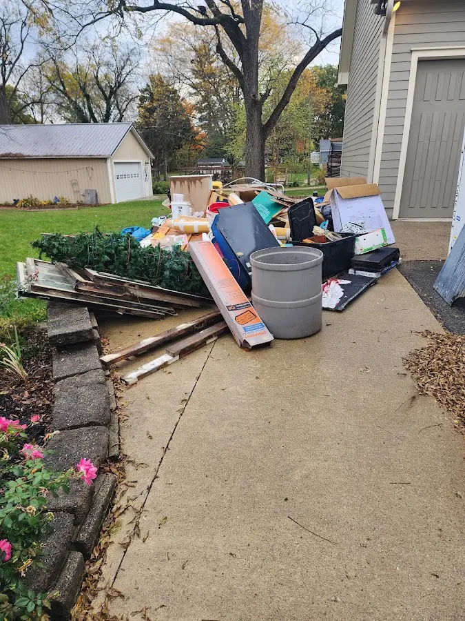 Dumpster being loaded with debris for 12 Yard Dumpster Rental in Philadelphia